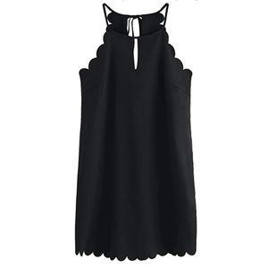 Black scalloped dress with peek-a-boo detailing